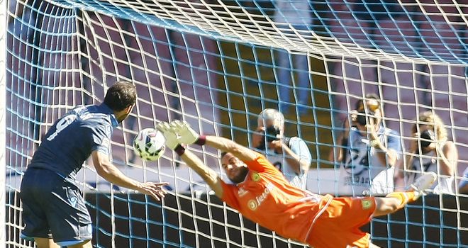 Chievo goalkeeper Francesco Bardi saves Gonzalo Higuain's penalty