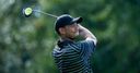 Woods toils as Spieth leads