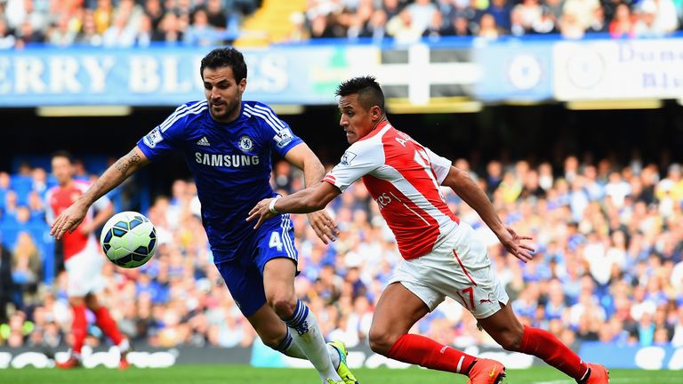 Cesc Fabregas in action with Alexis Sanchez at Stamford Bridge