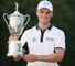 Martin Kaymer of Germany celebrates with the trophy after his eight-stroke victory during the final round of the 114th U.S. Open