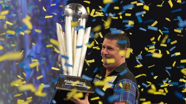 Gary Anderson celebrates with the Sid Waddell trophy last year