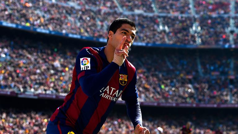 In-form Barca forward Luis Suarez celebrates opening the scoring at home to Rayo on Sunday morning, his first of two goals at Camp Nou