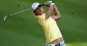 Reid recovers to retain lead