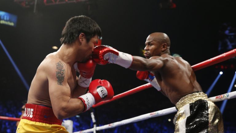 Pacquiao is still adamant he deserved to beat Floyd Mayweather (right)