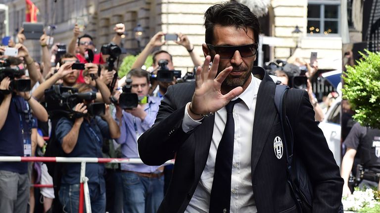 Juventus' goalkeeper and captain Gianluigi Buffon waves as he arrives at the team hotel in Berlin