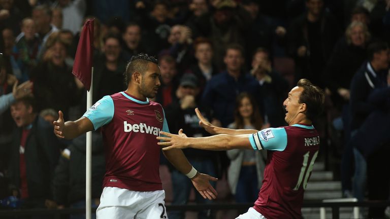 Dimitri Payet celebrates his first goal with West Ham captain Mark Noble (left)