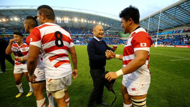 Jones congratulates his Japan team following victory over South Africa 