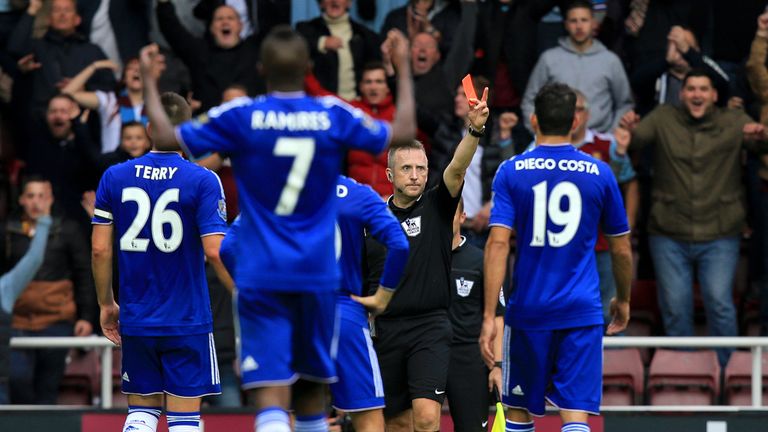 Chelsea captain John Terry (L) approaches ref Jon Moss to dispute Nemanja Matic's first-half dismissal at West Ham