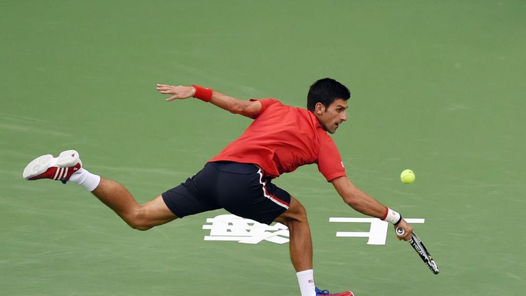 Djokovic reaches for a return during the Shanghai final
