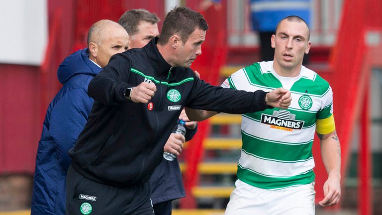 Celtic's Scott Brown talks to manager Ronny Deila at Fir Park