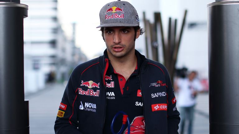 Carlos Sainz returns to the paddock on Saturday morning
