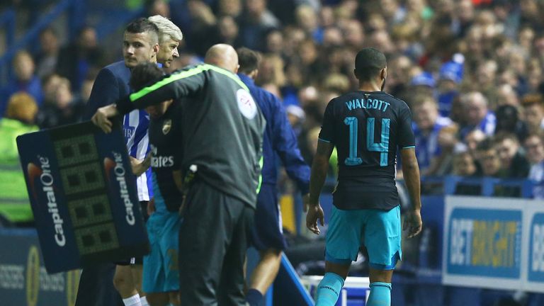 Theo Walcott (right) is still out with a calf injury suffered at Sheffield Wednesday