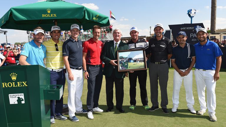 On the tee: Ivor Robson (centre) with a number of players who presented him with a painting following a 40-year career as the European Tour's official starter
