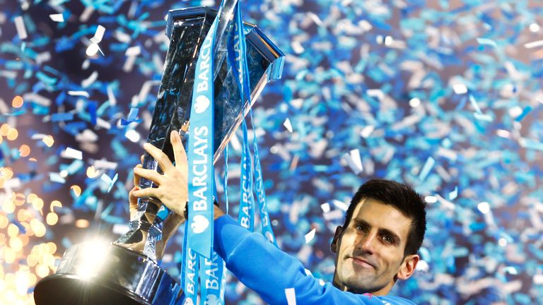 Novak Djokovic lifts the trophy following his victory