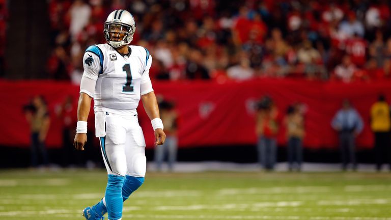 Quarterback Cam Newton looks dejected as Carolina's perfect season ends in Atlanta