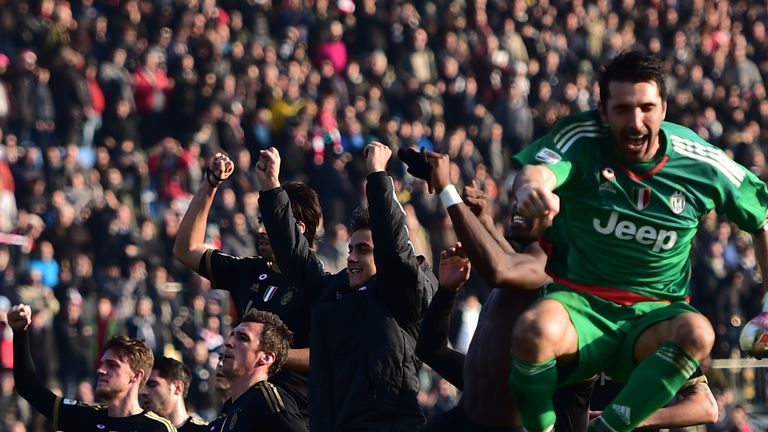 Juventus players celebrate their win at Carpi