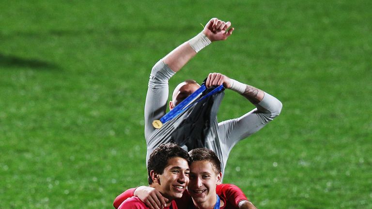 Reported Liverpool target Marko Grujic (left) celebrates after winning the U20 World Cup with Serbia