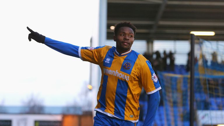 Jean-Louis Akpa Akpro of Shrewsbury Town celebrates scoring his team's first goal