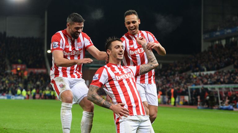 Joselu (centre) celebrates scored Stoke's second goal against Norwich