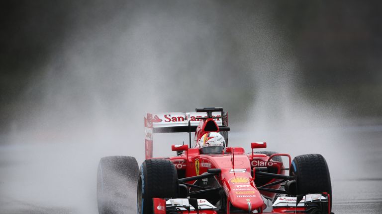 The German kicks up the spray on the artificially wet track