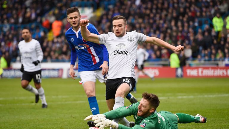 Everton's Tom Cleverley challenges for the ball with Carlisle goalkeeper Mark Gillespie