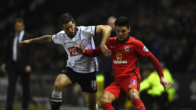 Derby goalscorer Butterfield battles for the ball with Blackburn's Ben Marshall