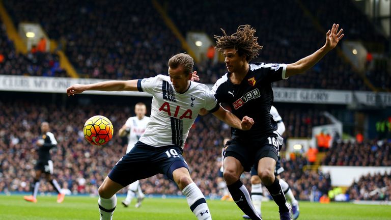 Harry Kane and Nathan Ake (right) compete for the ball