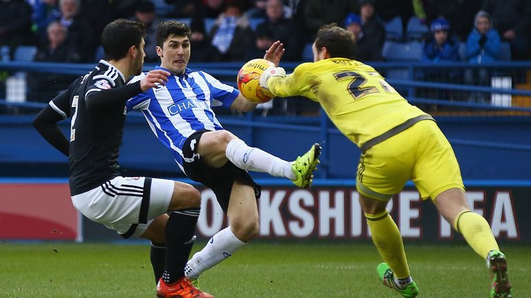 David Button stops a shot from Fernando Forestieri.