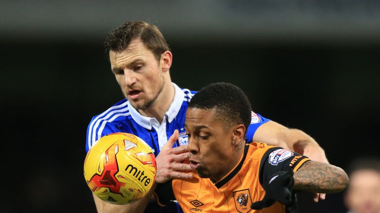 Tommy Smith and Abel Hernandez battle for the ball