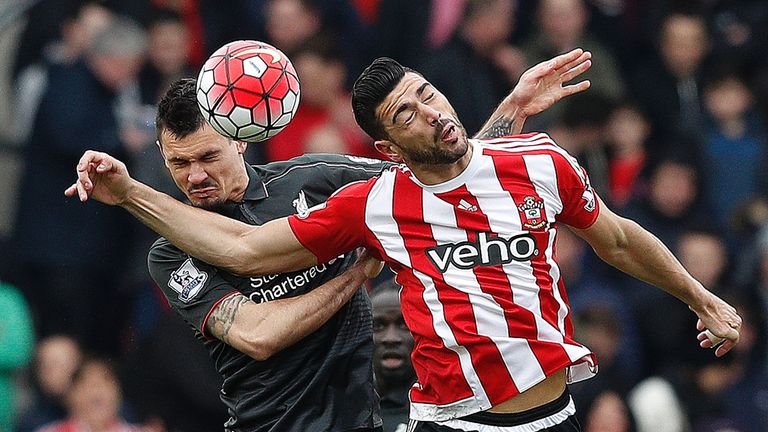 Dejan Lovren (left) and Graziano Pelle compete for the ball
