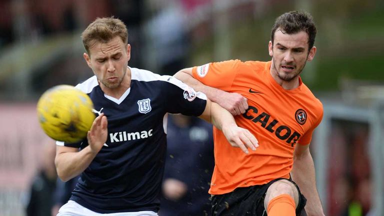Greg Stewart and Gavin Gunning battle for possession in the Tayside derby