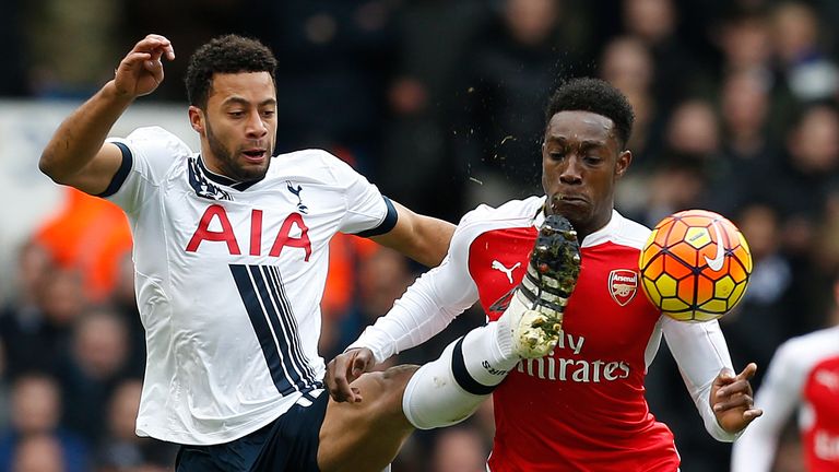 Mousa Dembele tussles with Danny Welbeck in the first-half at White Hart Lane