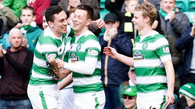 Callum McGregor (centre) is congratulated after scoring Celtic's third goal