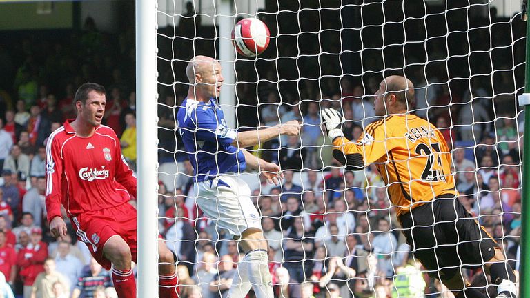 Andy Johnson puts the ball past Liverpool goalkeeper Pepe Reina