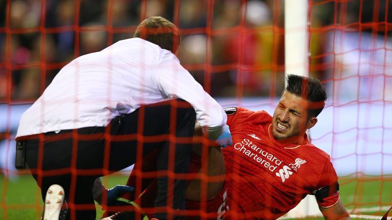 Emre Can receives treatment before being substituted against Dortmund