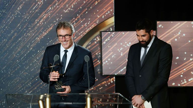 Paris Saint-Germain's French coach Laurent Blanc (left) receives the Ligue 1 2015-2016 Manager of the Year award