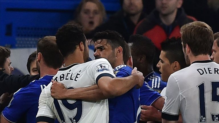 Mousa Dembele (left) and Diego Costa clash just before half-time