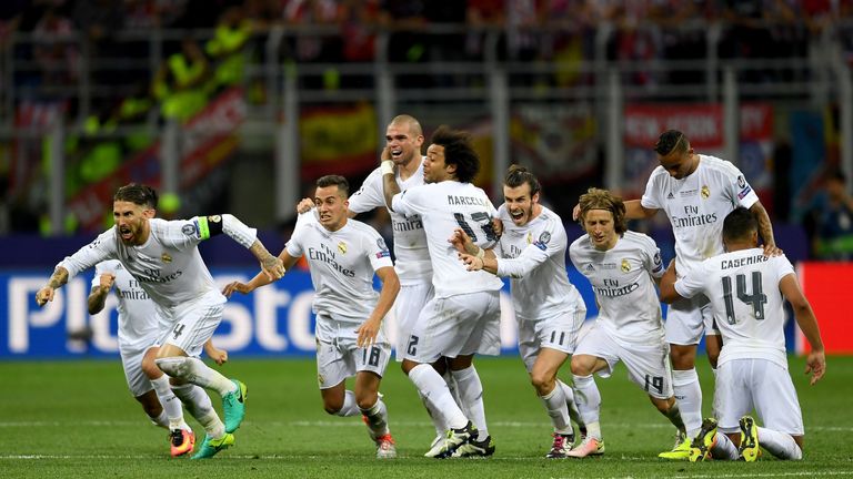 Real Madrid players celebrate after Ronaldo's winning penalty
