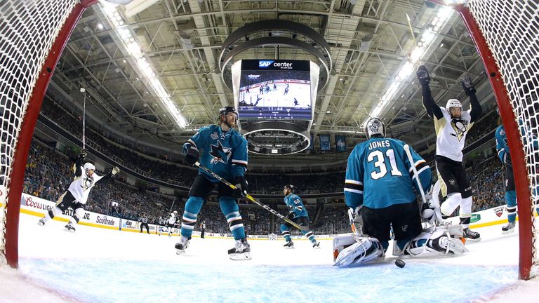 Martin Jones #31 of the San Jose Sharks allows a goal to Brian Dumoulin #8 of the Pittsburgh Penguins in the first period