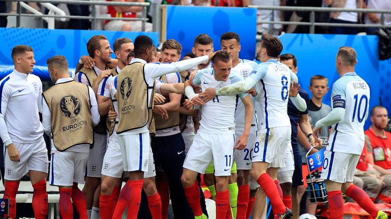 Vardy celebrates with team-mates after equalising for England