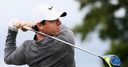 Classy McIlroy shares lead