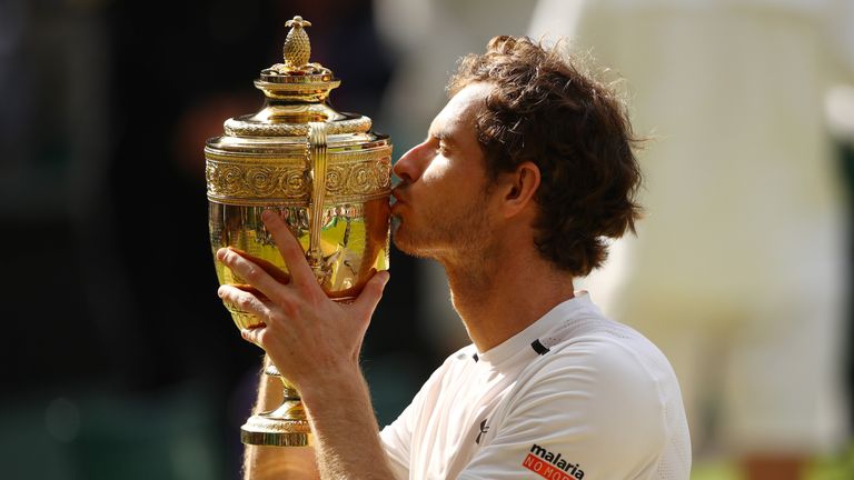 Murray kisses the trophy after winning the 2016 Wimbledon title