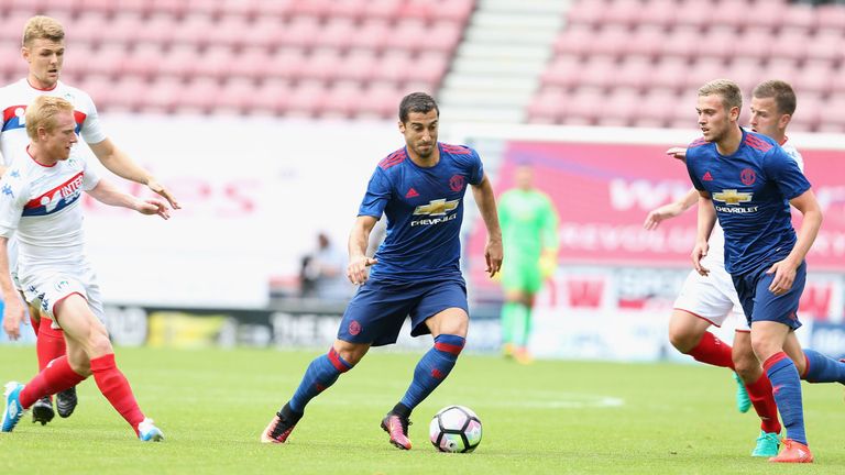 Henrikh Mkhitaryan (centre) has joined Man Utd from Borussia Dortmund