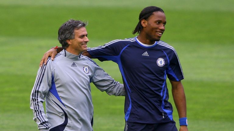 Mourinho (left) shares a joke with Didier Drogba in their Chelsea days