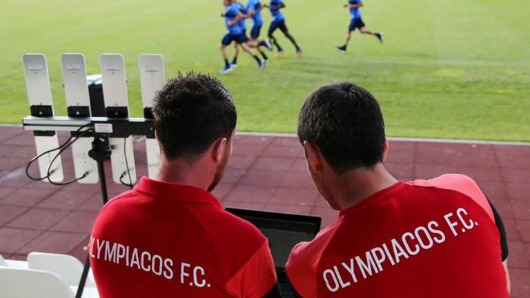 Technical staff at Greek side Olympiakos monitor STATSport data during training