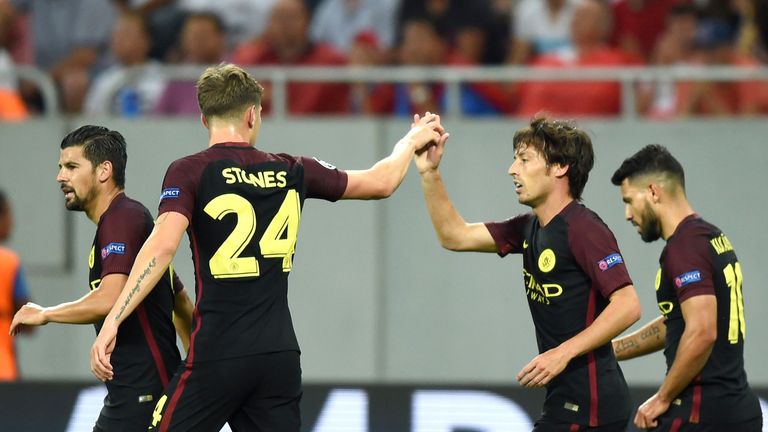 Silva (second right) celebrates scoring the opening goal