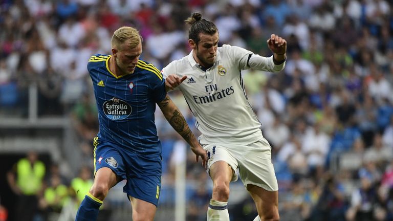 Gareth Bale (right) battles it out with Celta Vigo's Iago Aspas