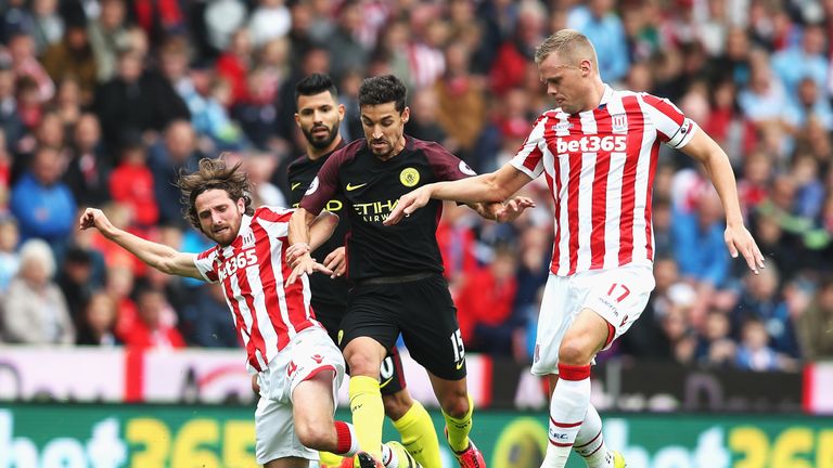 Joe Allen (L) in action for Stoke