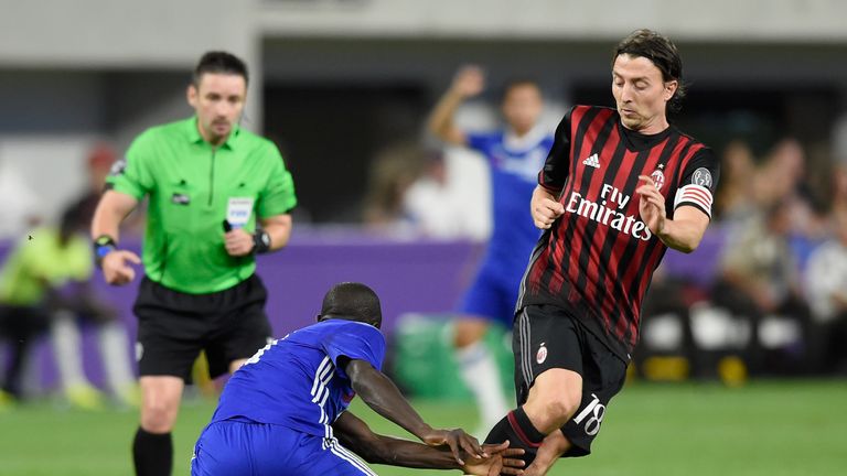 Kante challenges Milan skipper Riccardo Montolivo