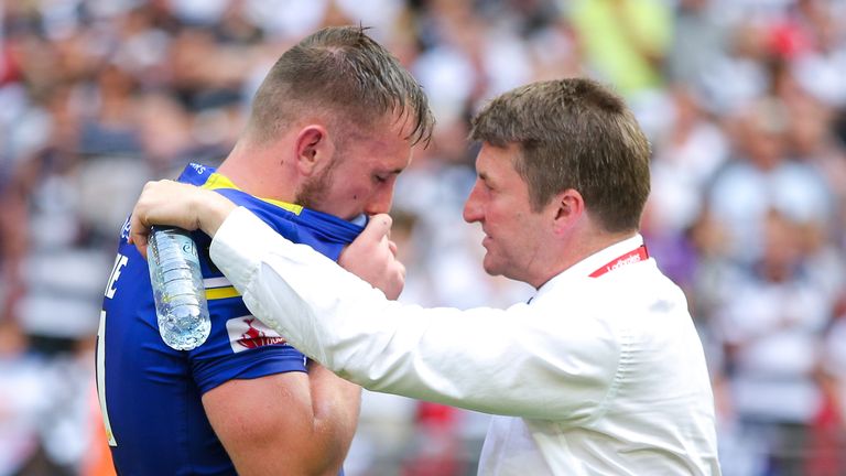 Ben Currie is consoled by Tony Smith following Wolves' Challenge Cup final loss